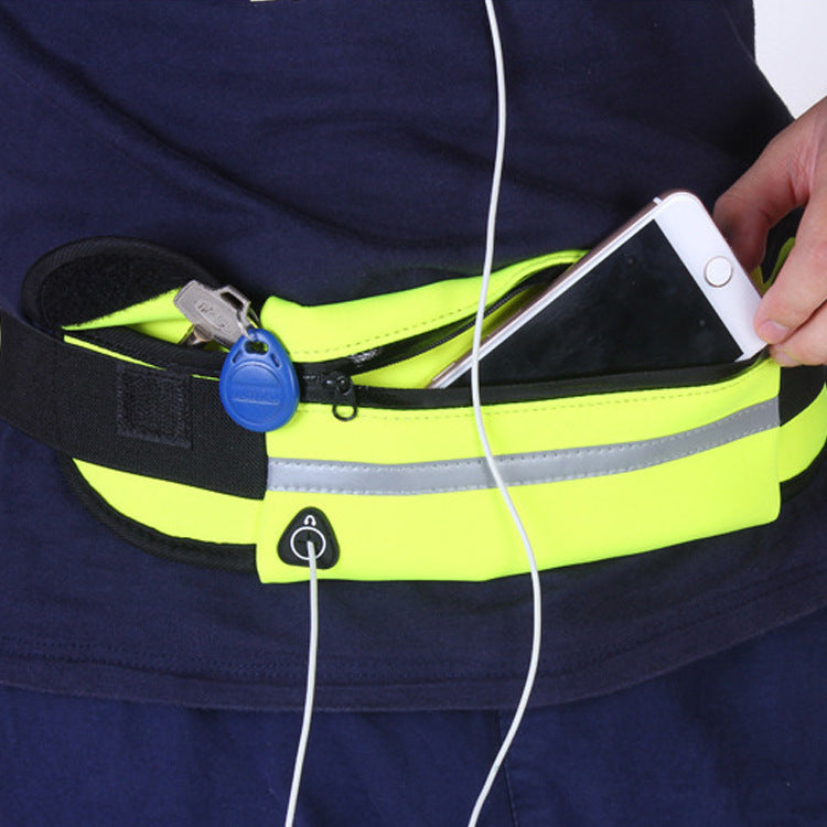 The RunOrFit Flex Belt worn under a shirt with headphones running out through the side port